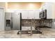 Modern kitchen with stainless steel appliances and granite countertops at 9042 Moonlit Meadows Loop, Riverview, FL 33578