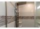 Multi-function shower with modern fixtures and tile surround at 9042 Moonlit Meadows Loop, Riverview, FL 33578