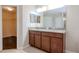 Bathroom with double vanity and granite countertop at 13167 Royal Pines Ave, Riverview, FL 33579