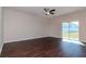 Spacious living room featuring hardwood floors and sliding glass doors at 13167 Royal Pines Ave, Riverview, FL 33579