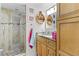 Bathroom with shower and wood vanity at 2579 Countryside Blvd # 1105, Clearwater, FL 33761