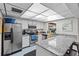 Well-equipped community kitchen with stainless steel appliances at 2579 Countryside Blvd # 1105, Clearwater, FL 33761