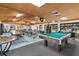 Spacious community room with pool table and seating at 2579 Countryside Blvd # 1105, Clearwater, FL 33761