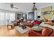 Living room with leather couches and hardwood floors at 2579 Countryside Blvd # 1105, Clearwater, FL 33761