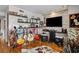 Living room with stone wall and entertainment center at 2579 Countryside Blvd # 1105, Clearwater, FL 33761