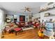 Living room with leather couches and hardwood floors at 2579 Countryside Blvd # 1105, Clearwater, FL 33761