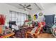 Relaxing sunroom with comfy seating and a treadmill at 2579 Countryside Blvd # 1105, Clearwater, FL 33761
