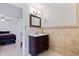 Bathroom with vanity, tiled walls, and mirror at 4111 32Nd N Ave, St Petersburg, FL 33713