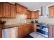 Kitchen with wood cabinets, granite countertops, and stainless steel appliances at 4111 32Nd N Ave, St Petersburg, FL 33713