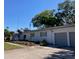 Charming home featuring a well maintained lawn, a two-car garage, and established landscaping at 415 21St N St, St Petersburg, FL 33713