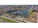 Aerial view of a waterfront condo with a marina, boat docks, and parking at 4939 Floramar Ter # 501, New Port Richey, FL 34652