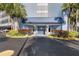 Building entrance showcasing a well maintained front and beautiful landscaping at 4939 Floramar Ter # 501, New Port Richey, FL 34652