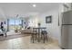 Bright, open-concept living and dining space with ample seating and a view at 4939 Floramar Ter # 501, New Port Richey, FL 34652