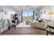 Bright, cozy living room with large windows, modern furnishings, and ample natural light at 4939 Floramar Ter # 501, New Port Richey, FL 34652