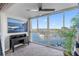 Home office with beautiful marina views from a large window and black desk at 4939 Floramar Ter # 501, New Port Richey, FL 34652