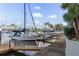 Dock and boat slip with boat, palm trees, and sunny skies at 4939 Floramar Ter # 501, New Port Richey, FL 34652