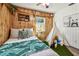 Charming bedroom with wood paneling, a teepee, and a leafy bedding set at 6034 17Th N Ave, St Petersburg, FL 33710