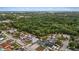 Aerial view of home nestled amongst lush greenery and neighboring houses at 6926 Williams Dr, Tampa, FL 33634