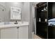 Bathroom with a vanity, storage closet, and mirror at 6926 Williams Dr, Tampa, FL 33634