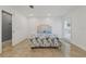 Bedroom with a queen bed and decorative headboard at 6926 Williams Dr, Tampa, FL 33634