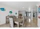 Bright dining room with a large table and chairs, and decorative wall art at 6926 Williams Dr, Tampa, FL 33634