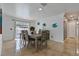 Dining room with table and chairs, view of pool, and decorative fish art at 6926 Williams Dr, Tampa, FL 33634