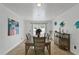 Spacious dining area with table and chairs, access to pool view at 6926 Williams Dr, Tampa, FL 33634