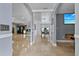Open entryway view of living and dining areas with tile floors at 6926 Williams Dr, Tampa, FL 33634