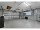 Spacious garage with overhead storage and epoxy floor at 6926 Williams Dr, Tampa, FL 33634