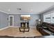 Living room features a large TV, leather couches, and a coffee table at 6926 Williams Dr, Tampa, FL 33634