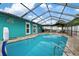 Inviting swimming pool with a screened enclosure at 6926 Williams Dr, Tampa, FL 33634