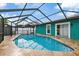Large swimming pool with a screened enclosure at 6926 Williams Dr, Tampa, FL 33634