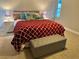 Cozy bedroom with decorative pillows, upholstered headboard, and stylish lamps at 6951 S Shore S Dr, South Pasadena, FL 33707