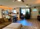 Bright living room with open layout, modern kitchen, and cozy seating area with view at 6951 S Shore S Dr, South Pasadena, FL 33707