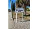 Welcome to Pasadena Isle signage near a palm tree and pine tree along the side of the street at 6951 S Shore S Dr, South Pasadena, FL 33707