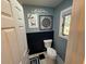 Simple bathroom with toilet and a window for natural light at 1005 Lake Avoca Pl, Tarpon Springs, FL 34689