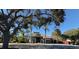 Community center with inviting entrance and landscaping at 1005 Lake Avoca Pl, Tarpon Springs, FL 34689