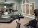 Fitness center equipped with treadmills and stationary bikes at 1005 Lake Avoca Pl, Tarpon Springs, FL 34689