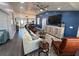 Open living area featuring a white sofa and a blue accent wall, hardwood floors at 1005 Lake Avoca Pl, Tarpon Springs, FL 34689
