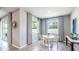Cozy breakfast nook with a round table and chairs near a window at 10609 Bridgegate Heights Loop, San Antonio, FL 33576