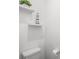 Small bathroom with toilet and floating shelves at 11312 Gallatin Trl, Parrish, FL 34219