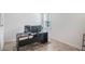 Modern home office with a desk, chair, and window with shutters at 11312 Gallatin Trl, Parrish, FL 34219