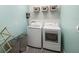 Laundry room with washer, dryer, and shelves at 11312 Gallatin Trl, Parrish, FL 34219