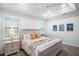 Bright bedroom with king-size bed and plantation shutters at 11312 Gallatin Trl, Parrish, FL 34219