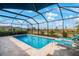 Screened-in pool and patio with lounge chairs at 11312 Gallatin Trl, Parrish, FL 34219