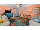 Bright living room with colorful rug, comfy sofas, and ceiling fan at 1602 30Th W St, Bradenton, FL 34205