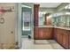 Spa-like bathroom with double vanity and walk-in shower at 19505 Coachlight Way, Lutz, FL 33549
