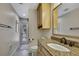 Bathroom with granite countertop, sink and shower at 19505 Coachlight Way, Lutz, FL 33549