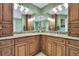 Bathroom with double vanity and granite countertop at 19505 Coachlight Way, Lutz, FL 33549