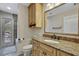 Bathroom with granite countertop, sink and shower at 19505 Coachlight Way, Lutz, FL 33549